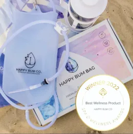 A Happy Bum Bag enema kit, showing the bag, tubing and packaging