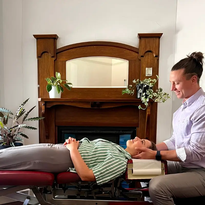Chiropractor Melbourne performing neck adjustment for headache relief