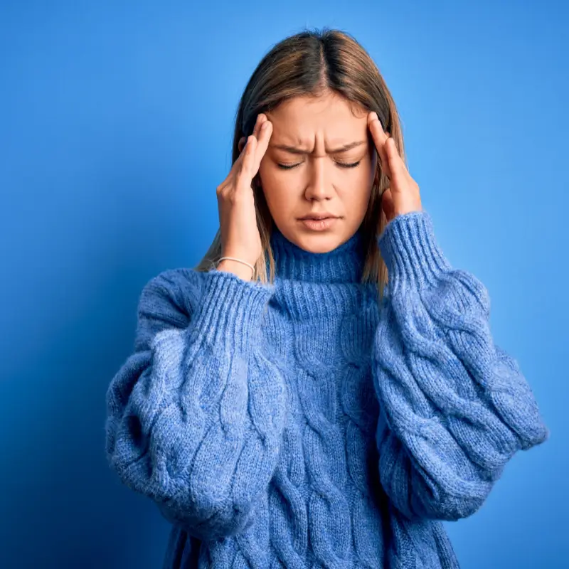 Young woman experiencing a headache – Chiropractor Melbourne support for migraine and tension headaches