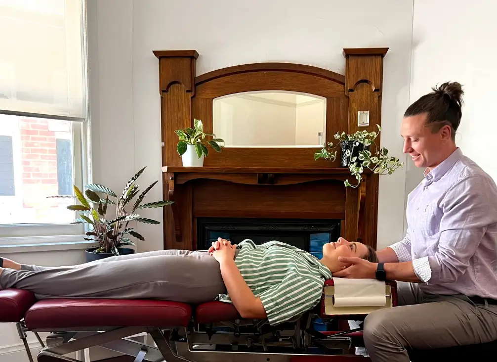 Chiropractor Melbourne treating neck pain with gentle hands-on therapy